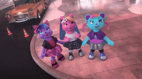 three stuffed animals are standing next to each other on a street