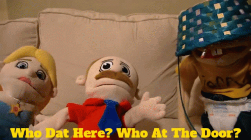 Three Stuffed Animals on Couch Saying Who Dat Here Who At Door