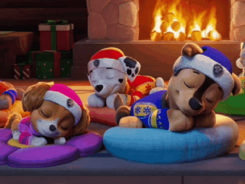 Three Stuffed Animals Sleeping By Fireplace GIF