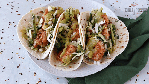 Three Tacos on White Plate