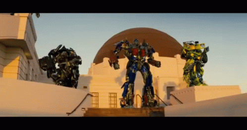 Three Transformers Standing in Front of Dome
