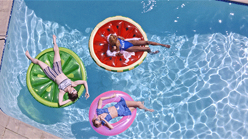 Three Woman Sunbathing In The Pool GIF
