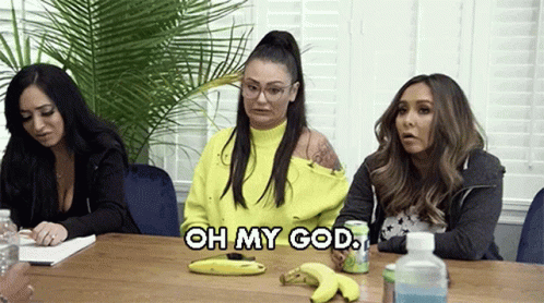 Three Women Are Sitting At A Table With Bananas And A Can Of Soda And One Of Them Is Saying `` Oh My God '' . GIF