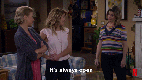Three Women Standing In Living Room Says It's Always Open GIF