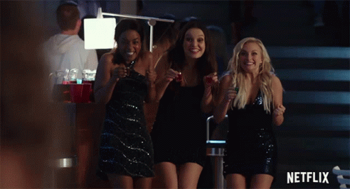 Three Women Are Standing In A Room With A Netflix Logo On The Bottom GIF