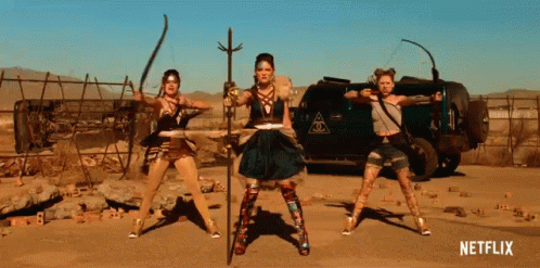 Women Standing In Front Of Netflix Sign GIF