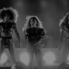 Three Women Dancing On Stage GIF