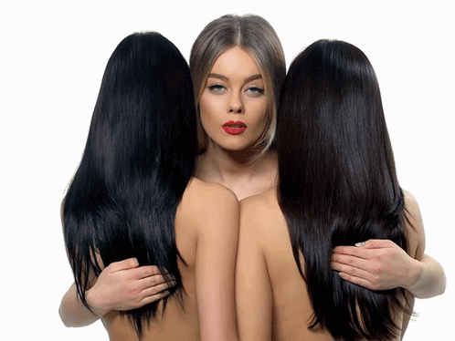 three women hugging each other with different colored hair