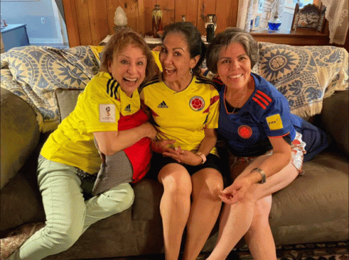 Three Women in Adidas Shirts on Couch