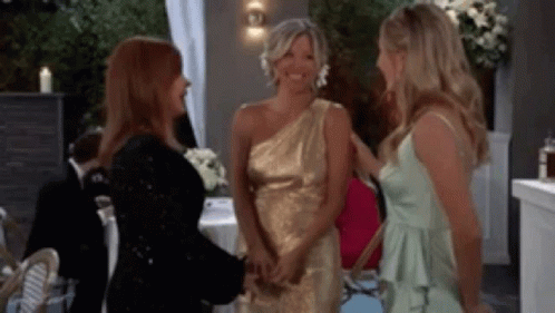 Three Women in Dresses Talking