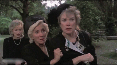 Three Women in Park One Wearing Feather Hat