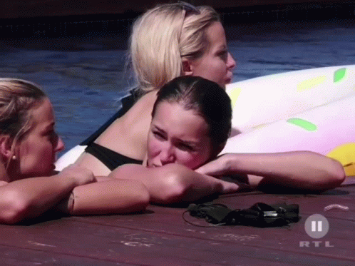 Three Women Laying On Dock With Rtl GIF