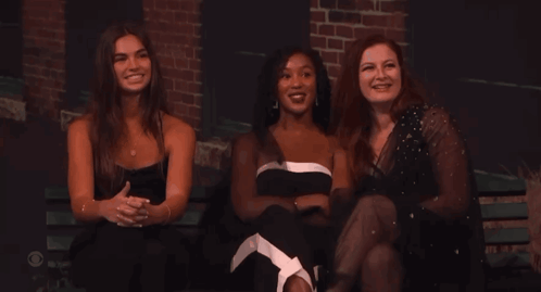 Three Women on Bench Arms Crossed