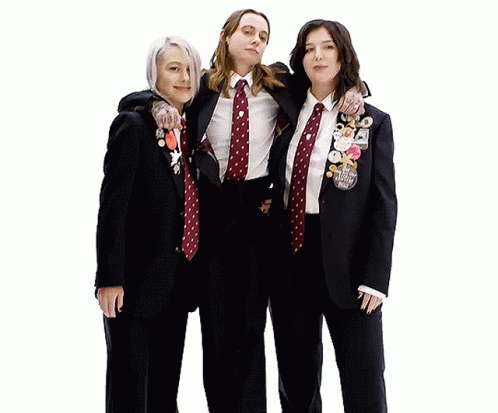 Three Women Posing One With I Love You Badge