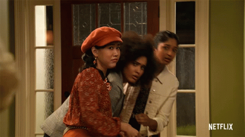 Three Women Standing In Front Of A Door With A Netflix Logo On The Bottom GIF