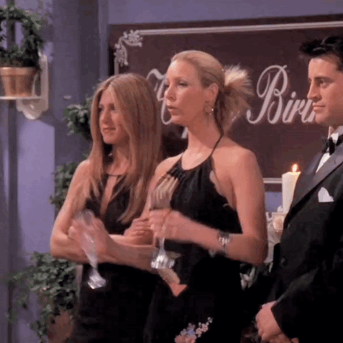 Three Women Standing In Front Of A Sign That Says Birdie GIF
