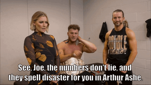 Three Wrestlers Are Standing In A Locker Room And One Of Them Is Wearing A Shirt That Says Double Threat GIF