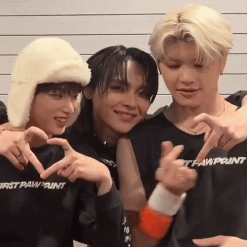 Three Young Men Making Heart Shape