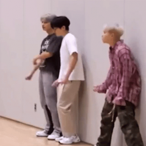 Three Young Men Standing Side by Side