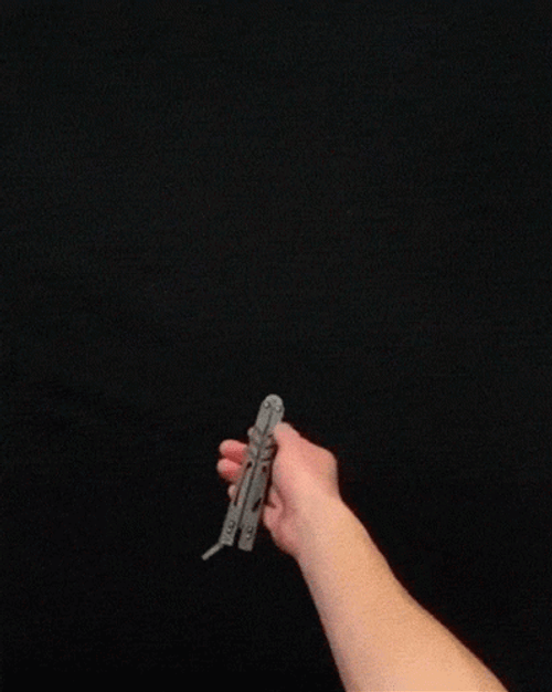 Thrilling Butterfly Knife Stunt GIF