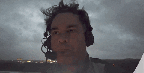 Man In Headset Scared During Thunderstorm GIF