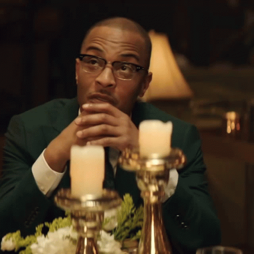 Ti Lifts His Hands In The Air GIF