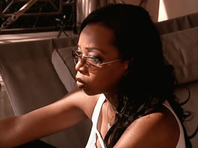 Tiffany Pollard Sitting On Floor Smoking GIF
