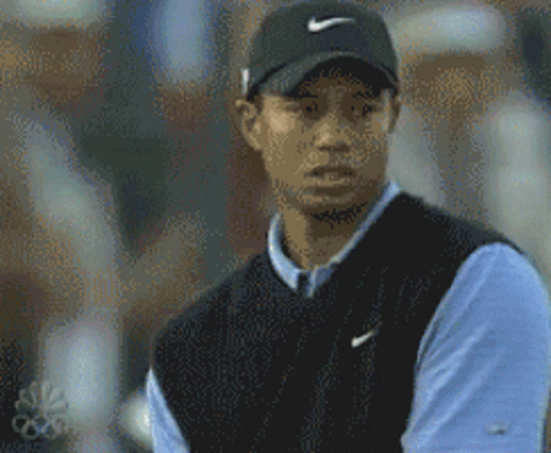 Tiger Woods Wearing Black Nike Hat And Blue Shirt GIF