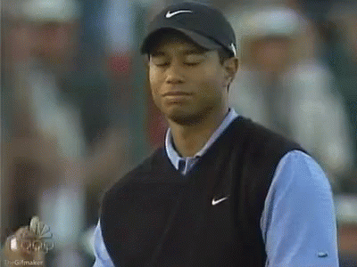 Tiger Woods Wearing Nike Hat and Vest