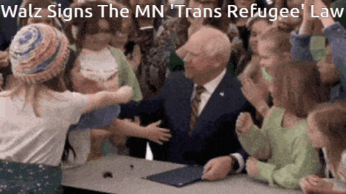 Tim Walz Signs The Law GIF