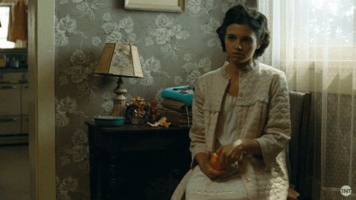 Timid India Eisley Peeling An Orange GIF