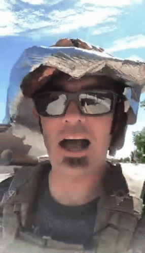Guy Donning Tinfoil Hat Under The Sun GIF