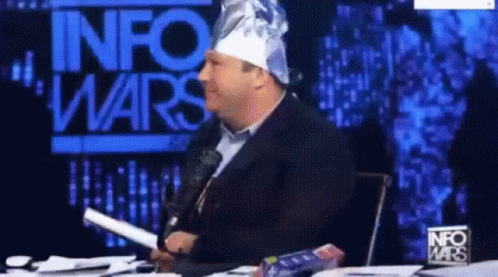 Alex Jones Wearing Tinfoil Hat Smirk GIF