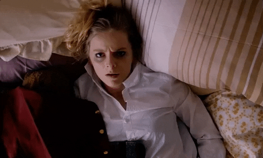 Tired Alice Foulcher Laying On Bed GIF