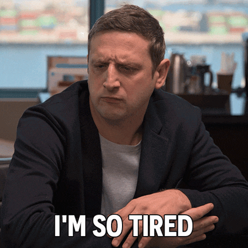 Tired Man Sitting at Table