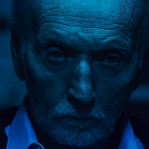 Tobin Bell Serious Face In Saw Movie GIF