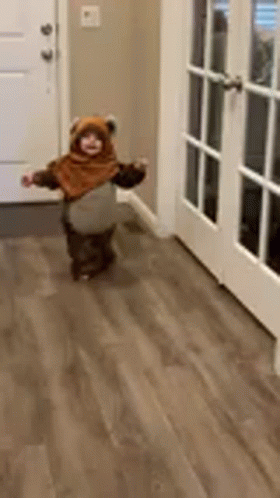 Toddler in Teddy Bear Costume Walking