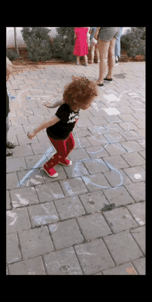 Toddler Jumping On The Ground GIF