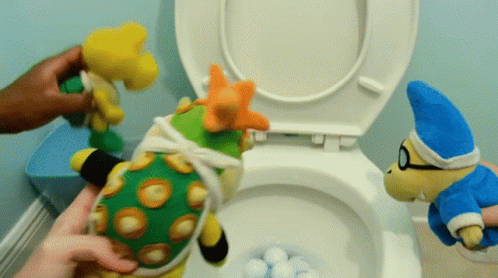 Golf Balls Flushing In The Toilet GIF