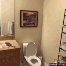 Toilet in Bathroom With Picture