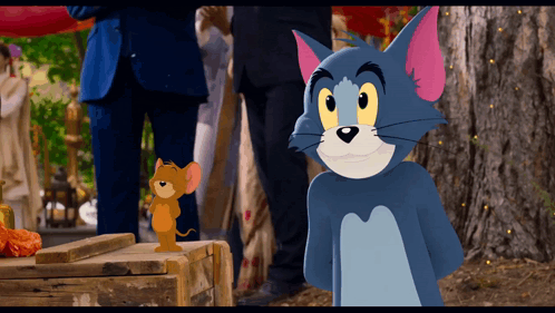 Tom And Jerry Are Standing Next To Each Other GIF