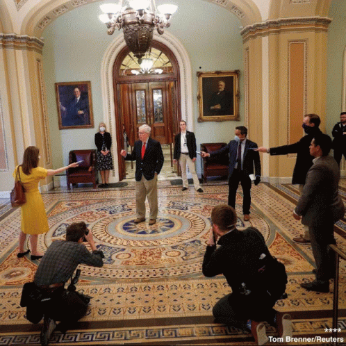 Tom Brenner Reuters Photographing Group in Hallway