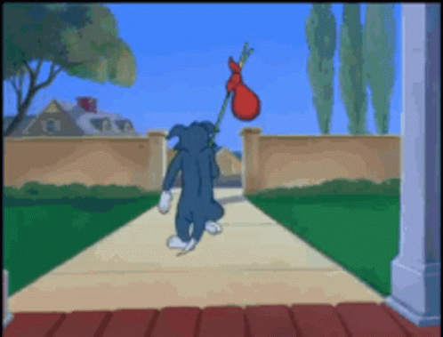 Tom Carrying Red Bag