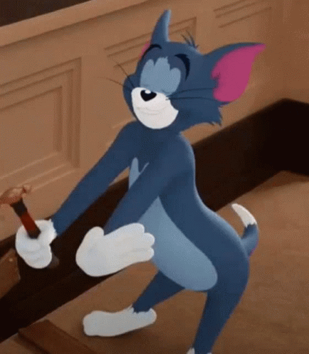 Tom From The Cartoon Tom And Jerry Is Standing On One Leg And Holding A Bottle . GIF