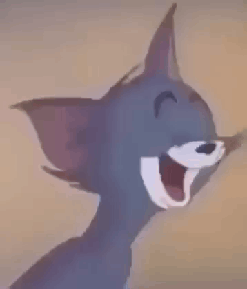 Tom From Tom And Jerry Is Laughing And Pointing At The Camera . GIF