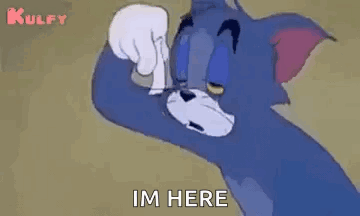 Tom From Tom And Jerry Is Standing In Front Of A Wall . GIF