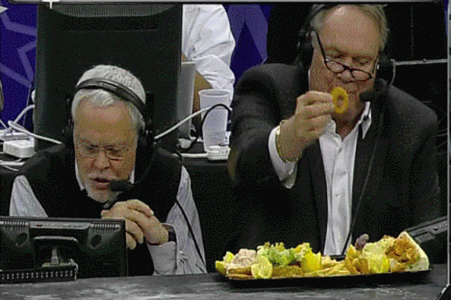 Tom Heinsohn And Mike Gorman Eating Nacho GIF
