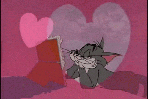 Tom Looking at Mirror with Pink Heart