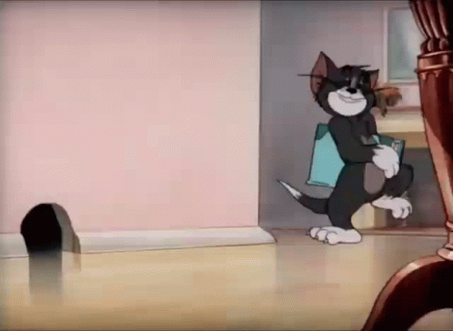 Tom Reading A Blank Book GIF