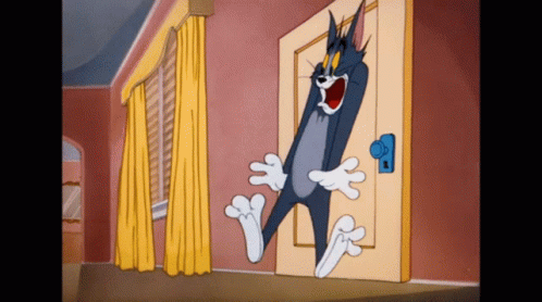 Tom Standing in Front of Door